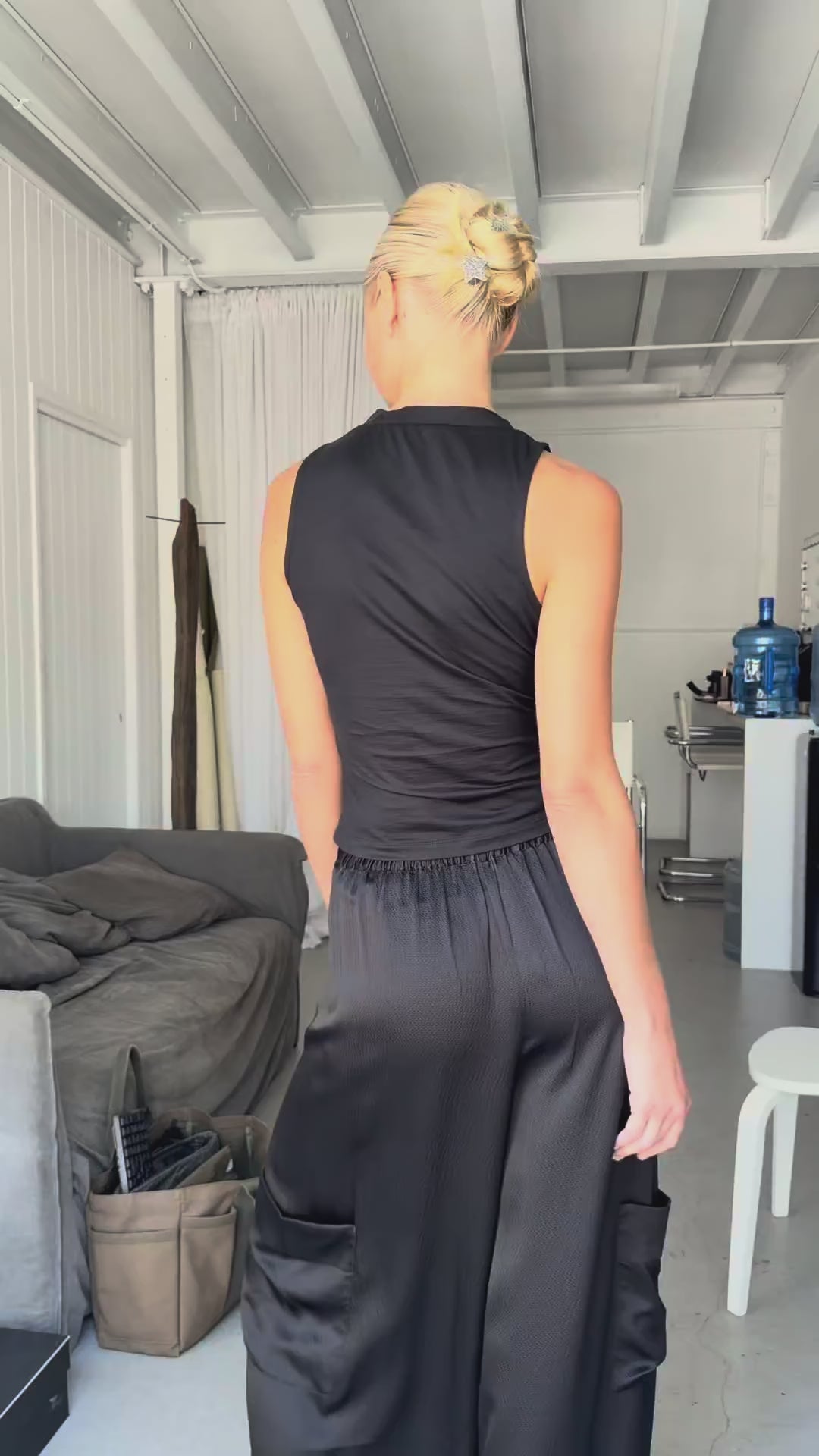 Video of silk jersey vest top worn by model, showing fabric movement and fit.