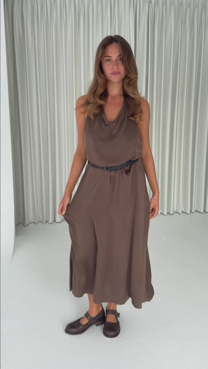 Model wearing the Hazelnut Silk Halter Dress in stretch silk with a relaxed silhouette, halter neckline and fluid drape.
