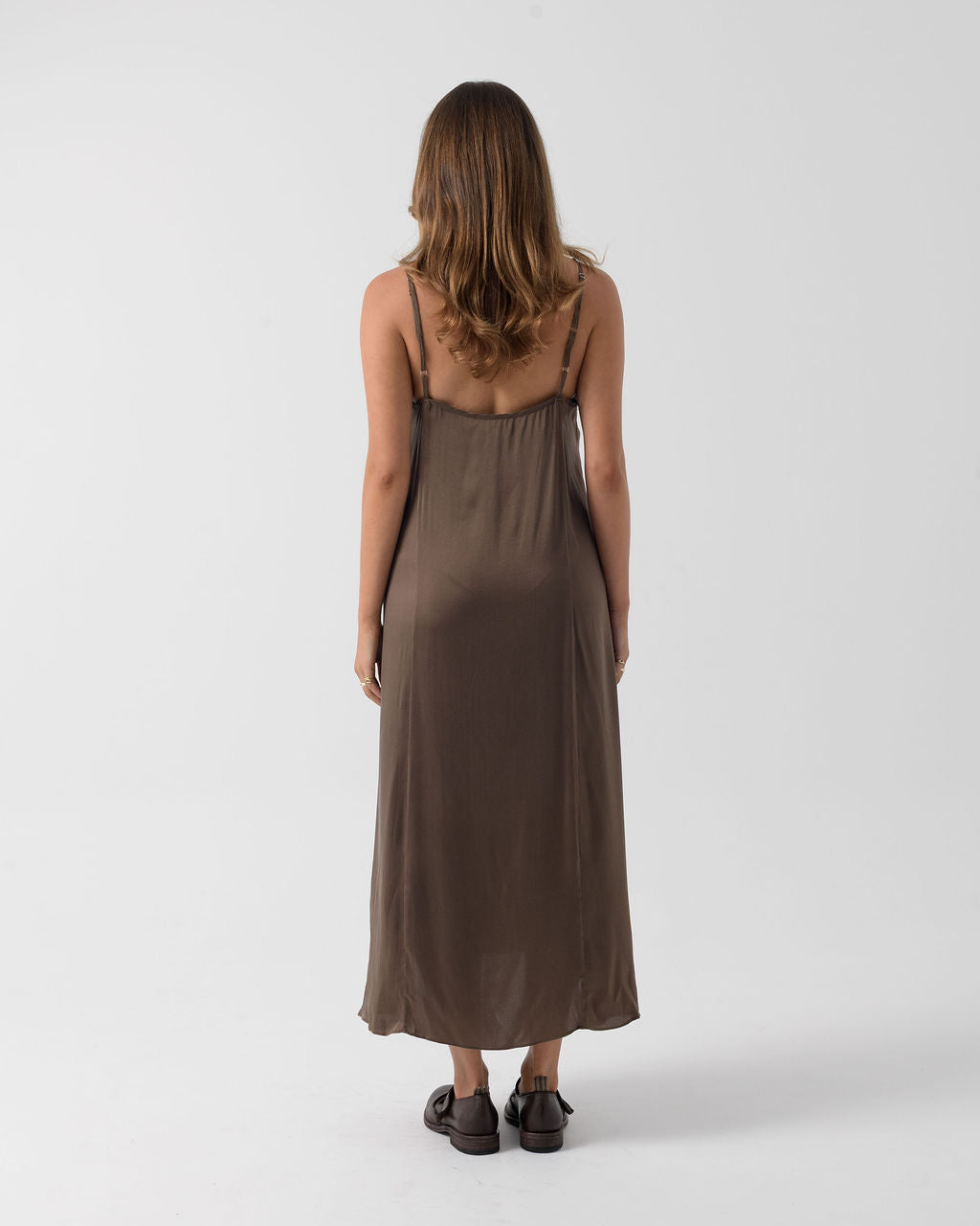 Back view of the Moka Signature Slip Dress showcasing the adjustable straps, relaxed silhouette and fluid full-length drape.