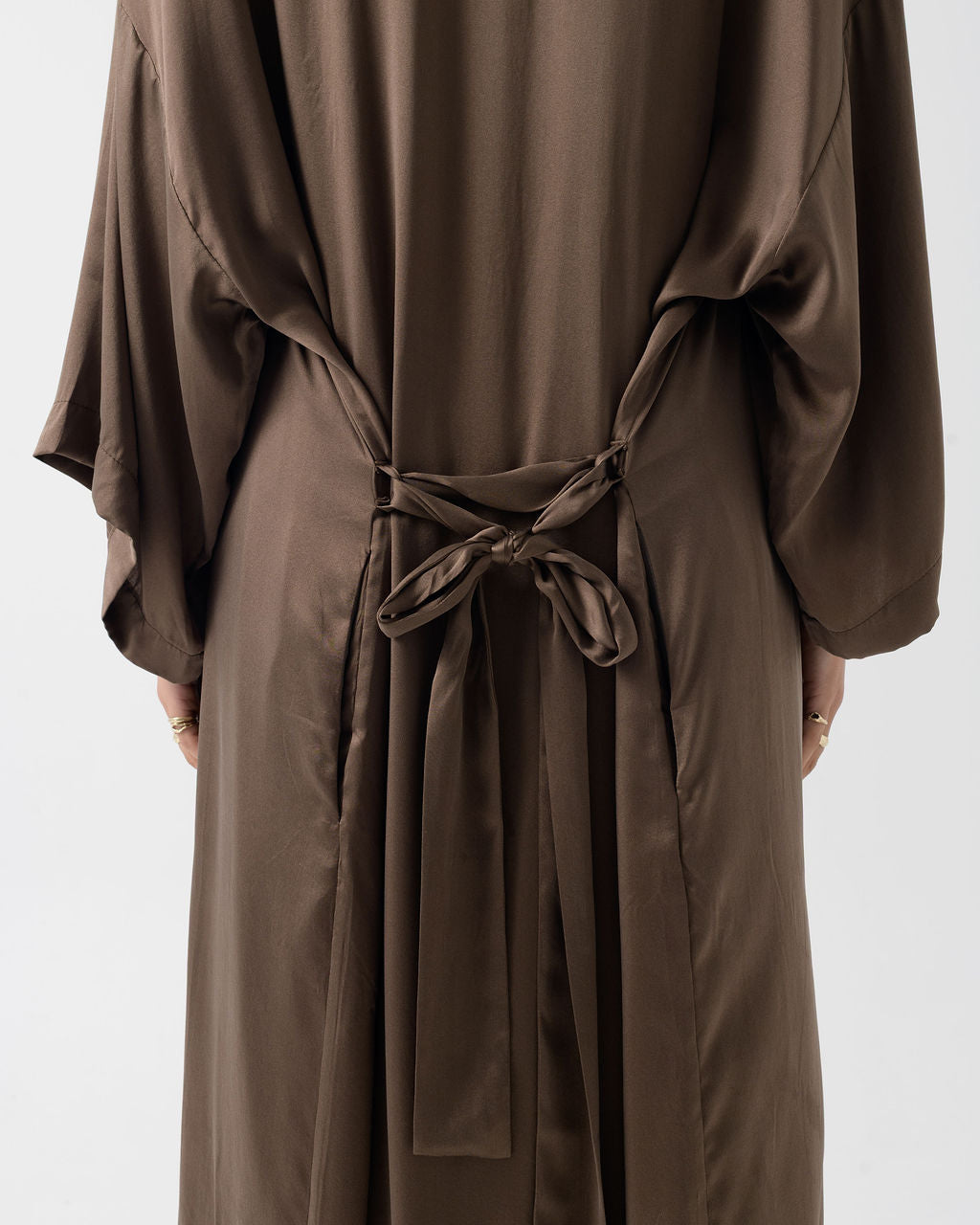 Close-up of the Moka Stretched Silk Robe showcasing the adjustable back waist tie and smooth stonewashed silk finish.